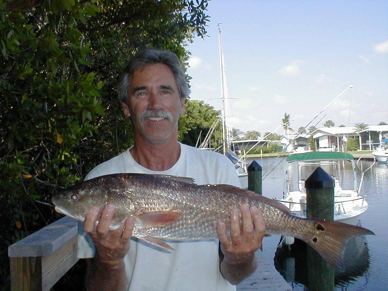 redfishhappyfisherman.jpg